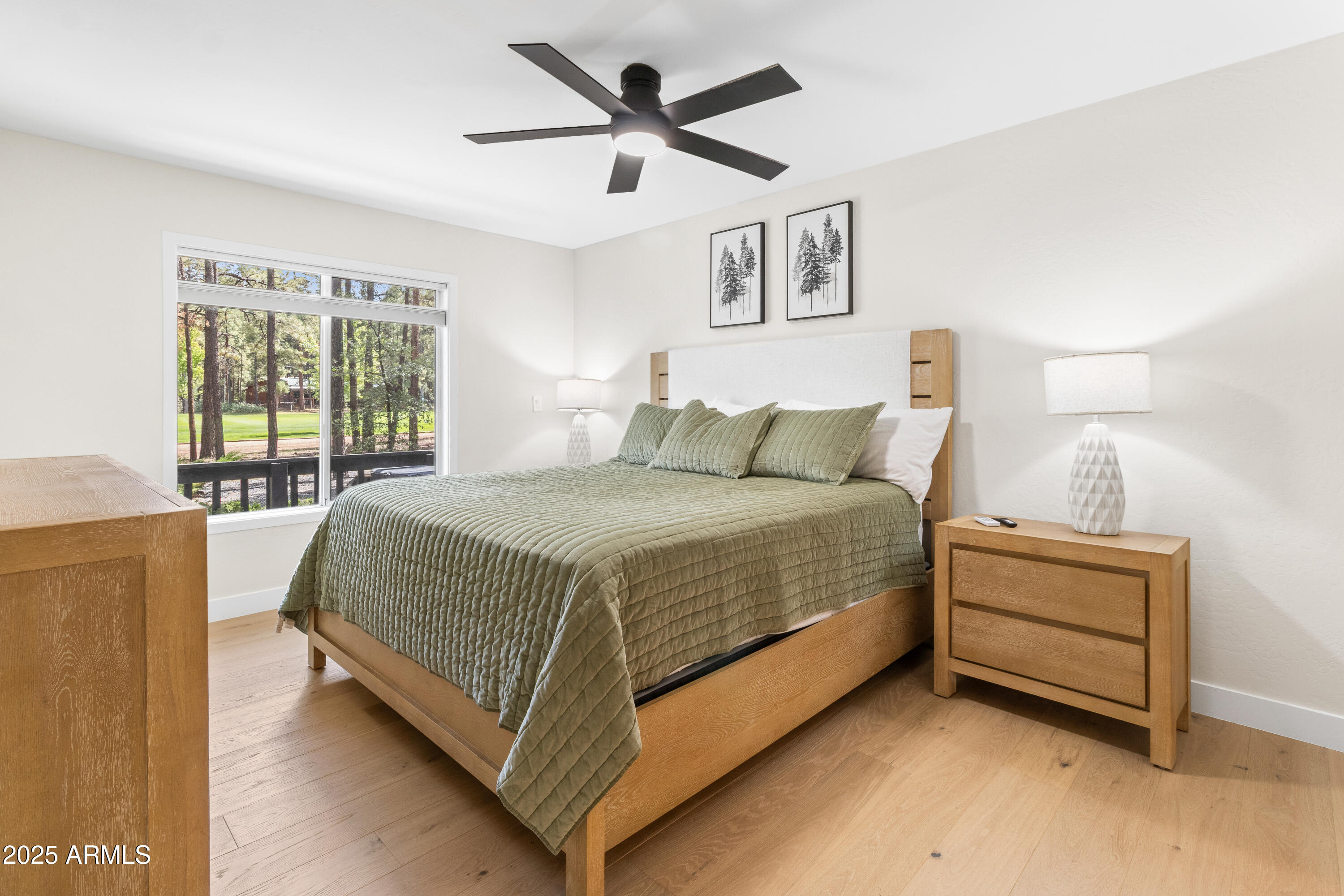 7451 Buck Springs Road Pinetop, AZ 85935 - Photo 26 of 35 a bedroom with a bed and a large window
