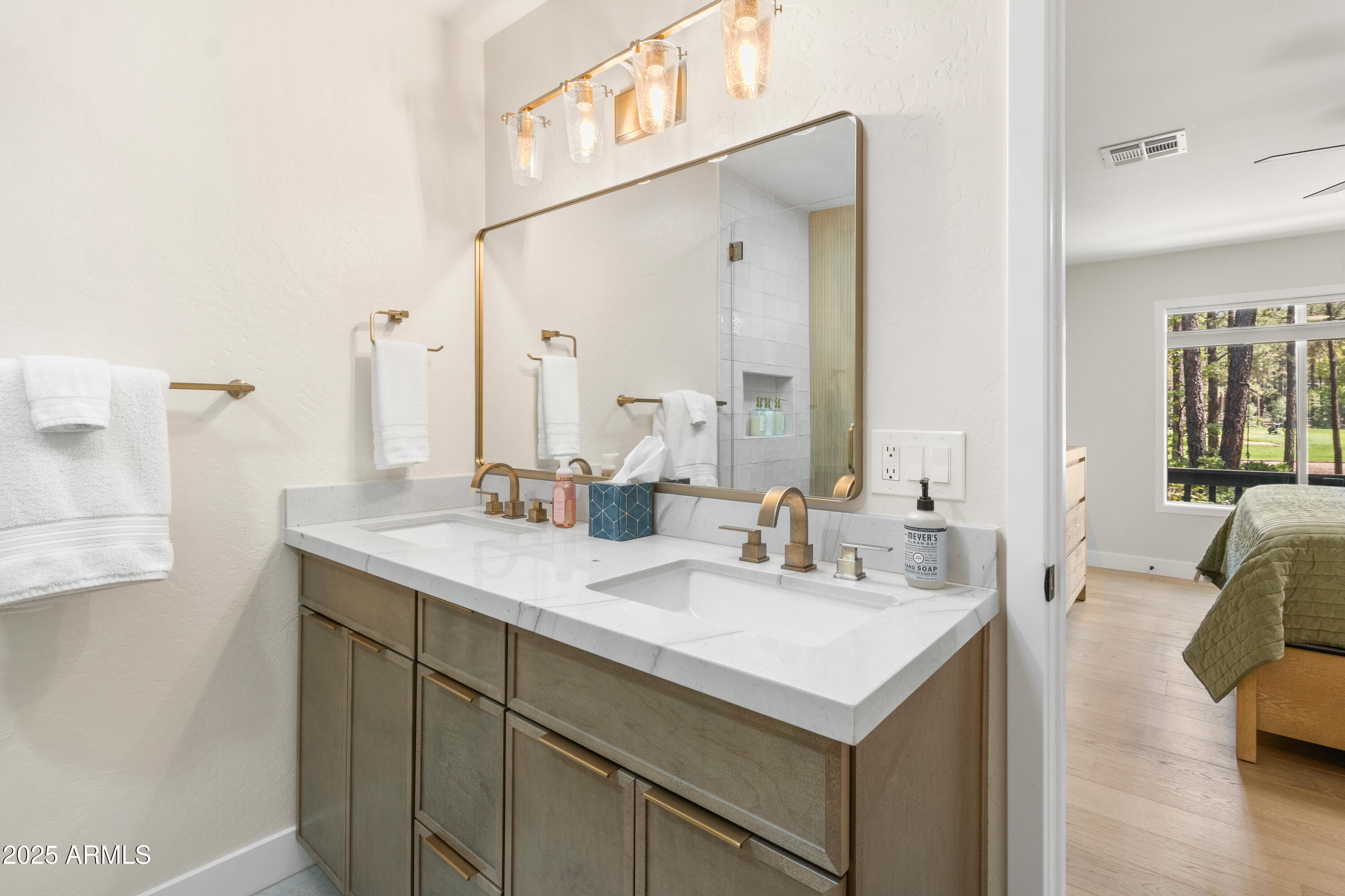 7451 Buck Springs Road Pinetop, AZ 85935 - Photo 29 of 35 a bathroom with a sink and a mirror