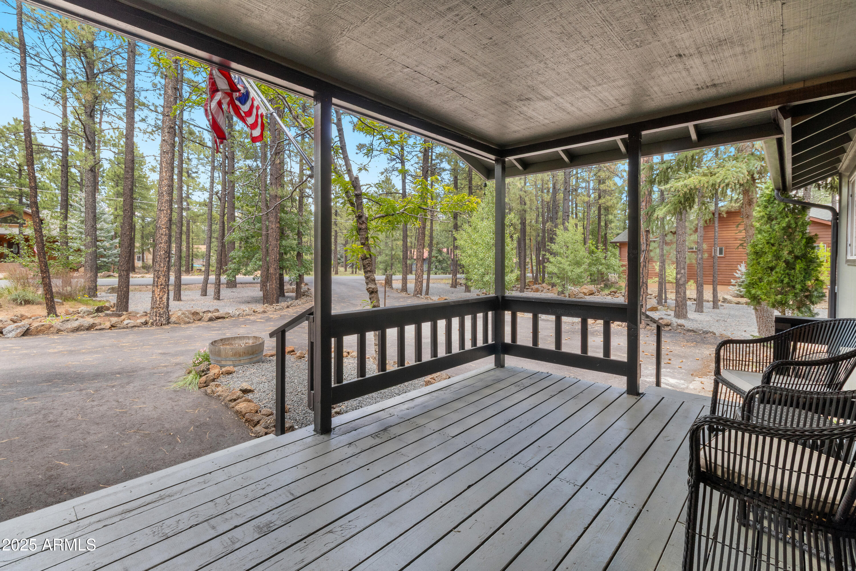 7451 Buck Springs Road Pinetop, AZ 85935 - Photo 5 of 35 a view of a porch with wooden floor