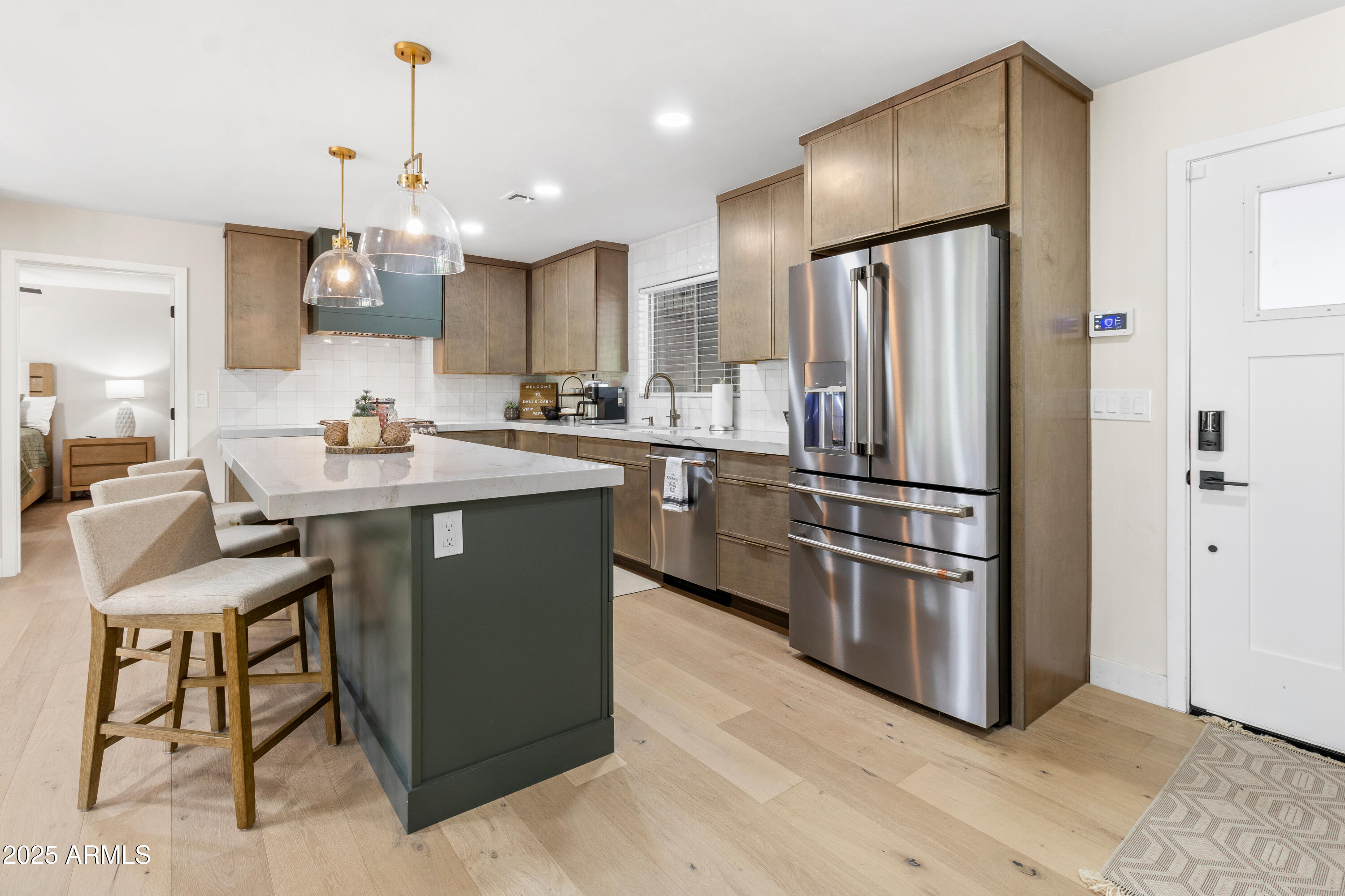 7451 Buck Springs Road Pinetop, AZ 85935 - Photo 9 of 35 a kitchen with stainless steel appliances granite countertop a sink a stove a refrigerator and island