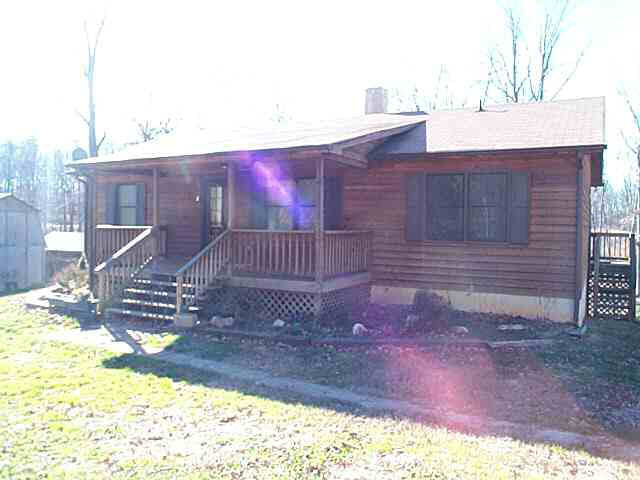 963 Doctors Road Louisa, VA 23093 - Photo 2 of 4 a view of a house with a yard