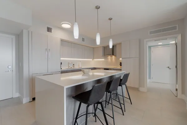 a kitchen with a table and chairs in it