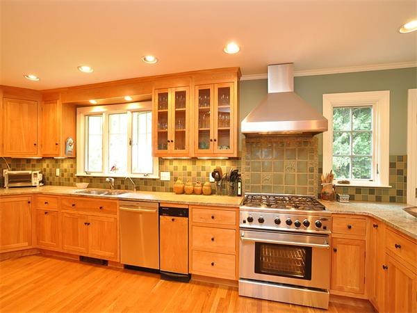 207 Concord Road Lincoln, MA 01773 - Photo 12 of 29 a kitchen with a stove a sink and a microwave