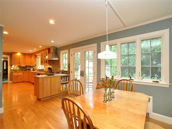 207 Concord Road Lincoln, MA 01773 - Photo 14 of 29 a dining room with stainless steel appliances kitchen island granite countertop a table and chairs