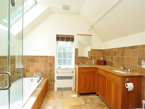 207 Concord Road Lincoln, MA 01773 - Photo 18 of 29 a bathroom with a tub sink and mirror