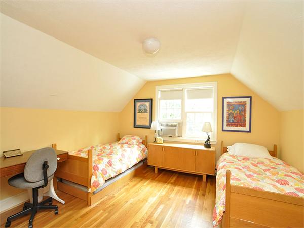 207 Concord Road Lincoln, MA 01773 - Photo 21 of 29 a bedroom with a bed and a chair