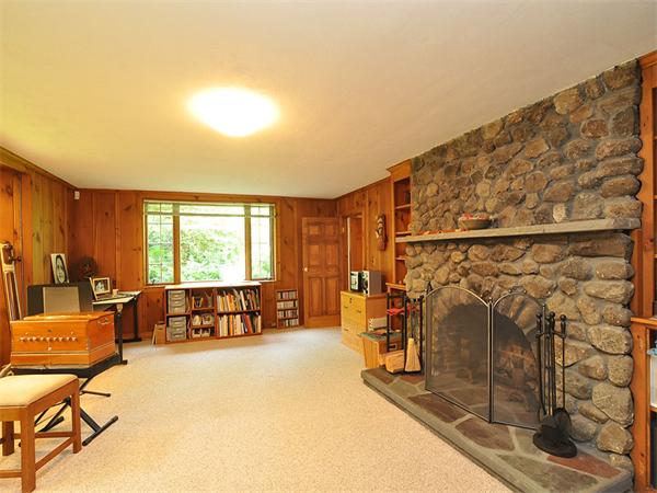 207 Concord Road Lincoln, MA 01773 - Photo 23 of 29 a living room with a couch and a table