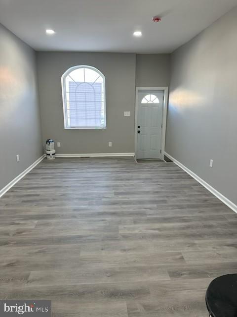2225 West Baltimore Street Baltimore, MD 21223 - Photo 5 of 5 an empty room with wooden floor and windows