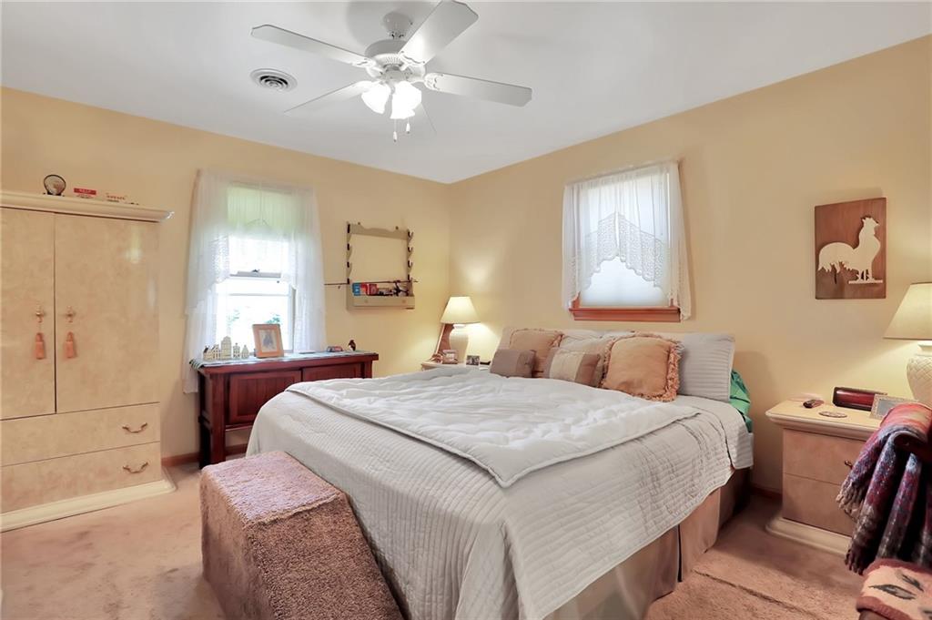 188 East Dutch Corner Road McConnellsburg, PA 17233 - Photo 21 of 25 a bedroom with a bed and a chandelier