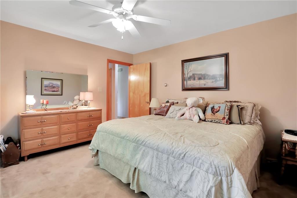 188 East Dutch Corner Road McConnellsburg, PA 17233 - Photo 5 of 25 a bedroom with a bed and a chandelier