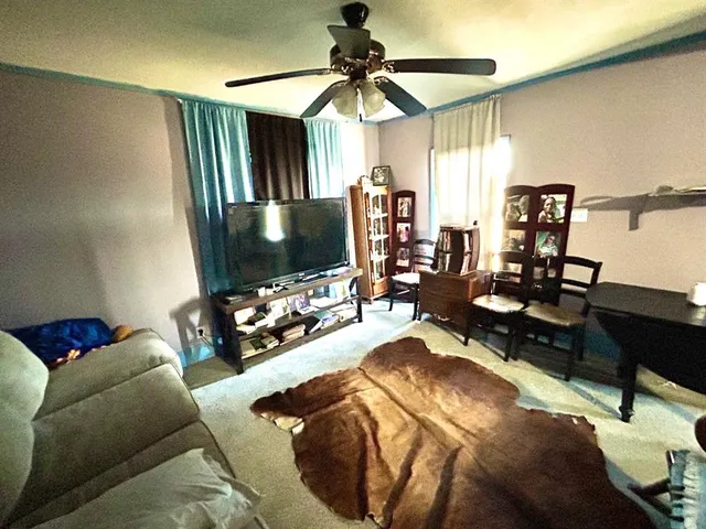 a kitchen with a sink a stove and cabinets