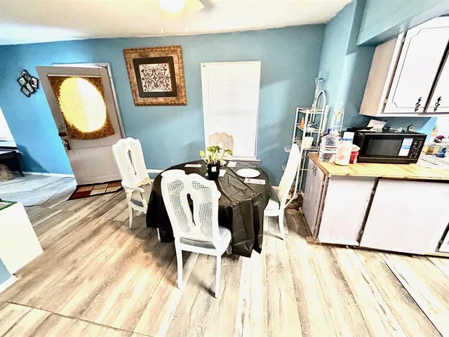 a kitchen with stainless steel appliances granite countertop a sink and a microwave