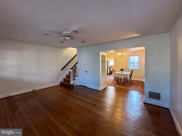 a view of a livingroom with furniture and hardwood floor