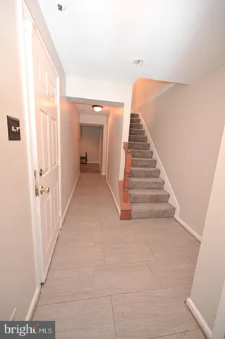 a view of a hallway with stairs