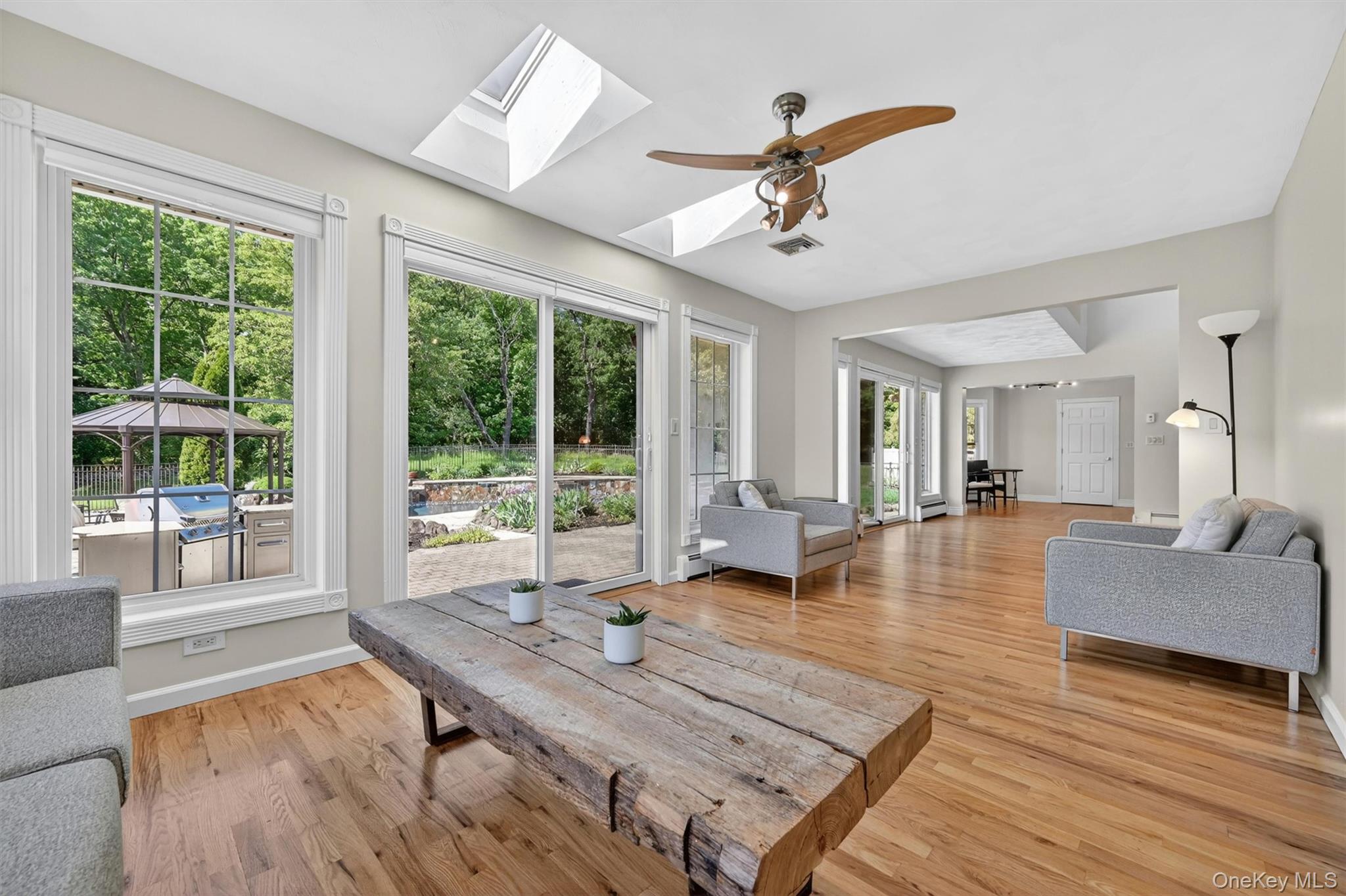 954 Ridgebury Road New Hampton, NY 10958 - Photo 15 of 45 With skylights above and patio views just beyond the glass doors, this space is perfect for lounging, reading, or gathering with guests.
