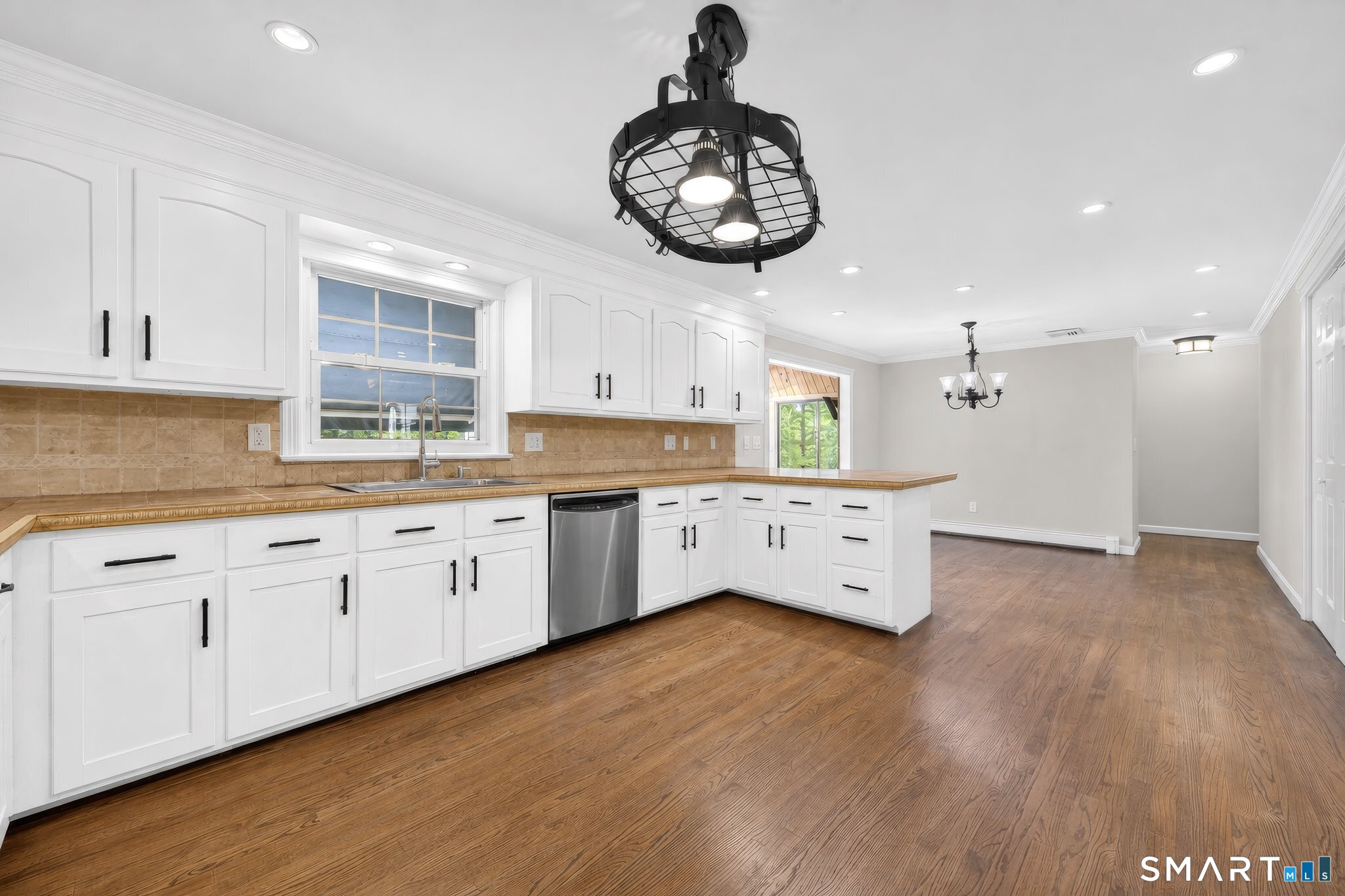 70 Barrack Hill Road Ridgefield, CT 06877 - Photo 6 of 32 a large white kitchen with a window and a clock
