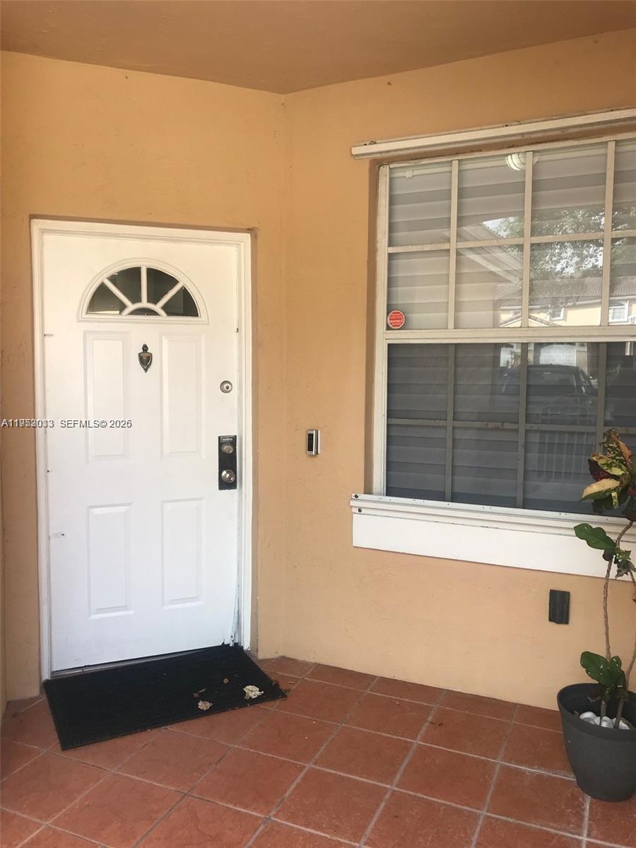 14621 Balgowan Road, Unit 1023 Miami Lakes, FL 33016 - Photo 4 of 21 a view of a small space with wooden floor