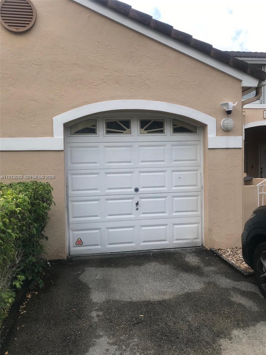 14621 Balgowan Road, Unit 1023 Miami Lakes, FL 33016 - Photo 5 of 21 a view of garage and small space
