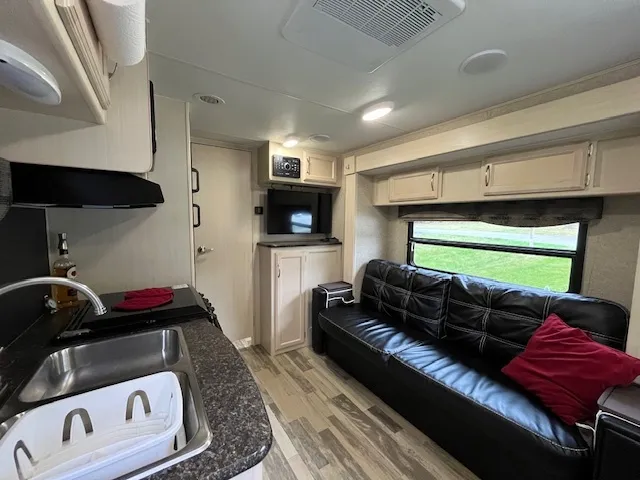 a living room with a couch and a flat screen tv