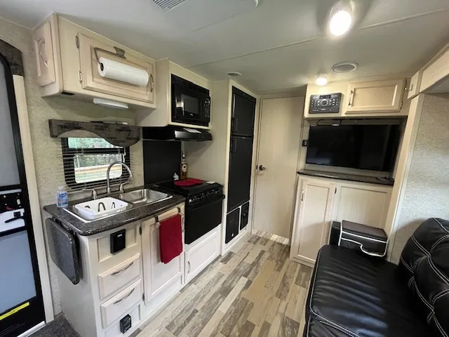a kitchen with a stove and a microwave