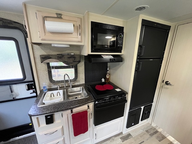 2795 East 28th Road Marseilles, IL 61341 - Photo 17 of 62 a kitchen with a stove and a microwave
