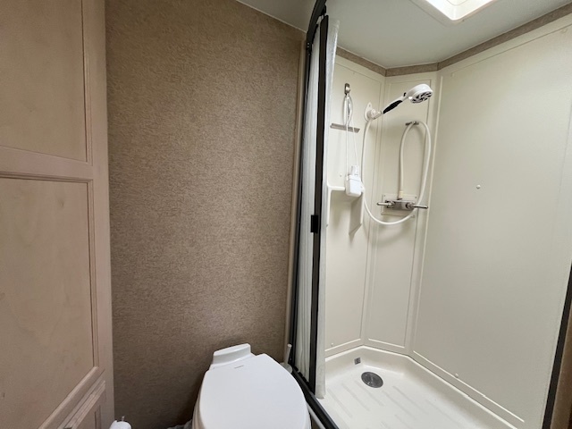 2795 East 28th Road Marseilles, IL 61341 - Photo 20 of 62 a bathroom with a granite countertop toilet a sink and shower