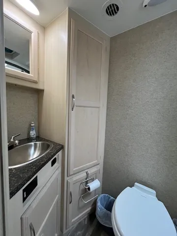 a view of a backyard with a garden and entertaining space