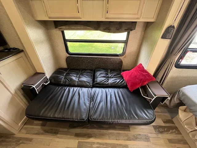 a view of living room with furniture and a fireplace