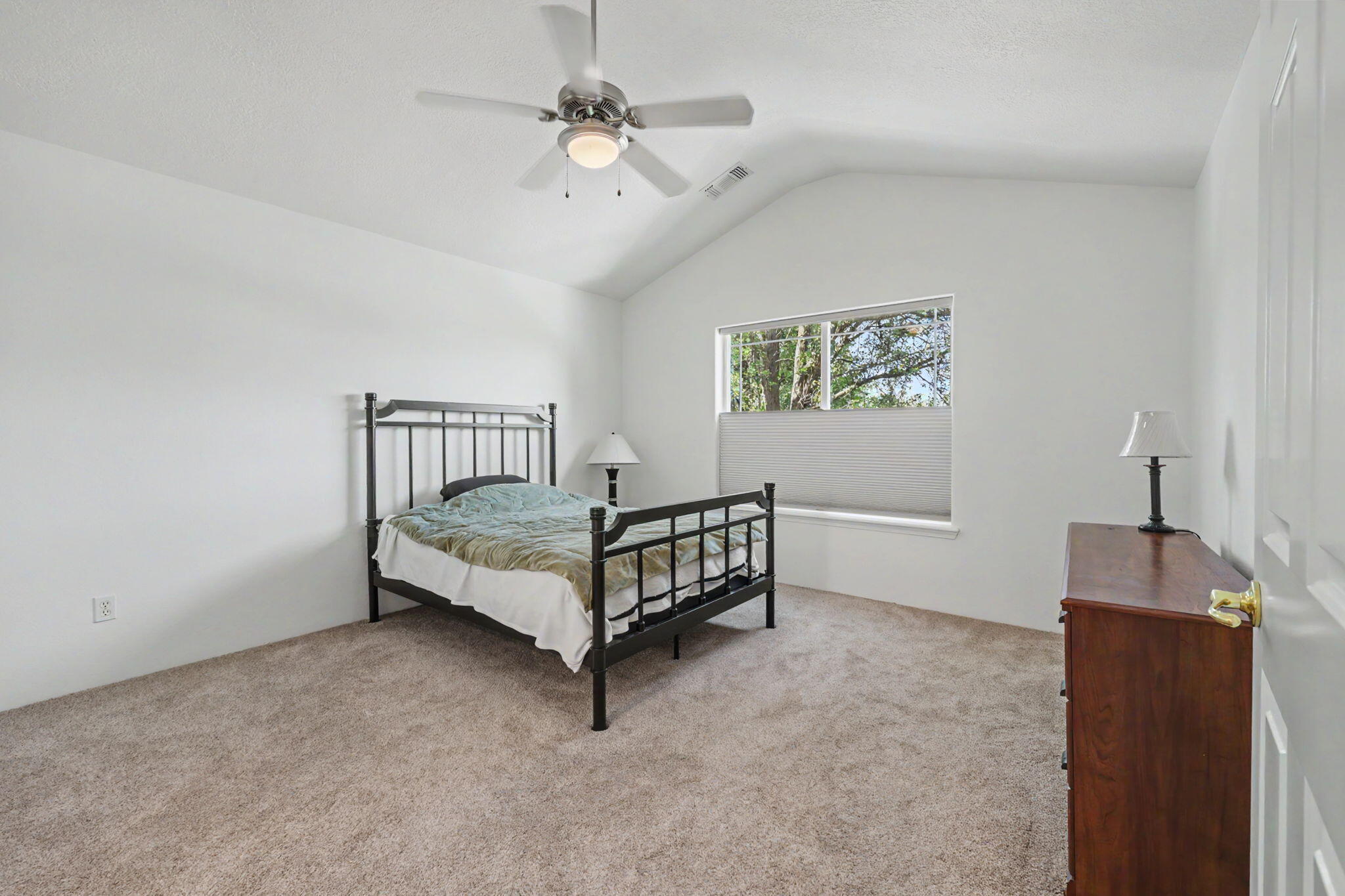 228 Talent Avenue, Unit 4 Talent, OR 97540 - Photo 17 of 23 Spacious primary bedroom upstairs with vaulted ceiling
