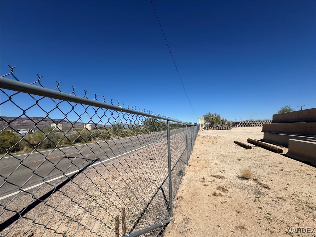 12248 South Yucca Frontage Road Yucca, AZ 86438 - Photo 13 of 16 a view of roof and wooden fence