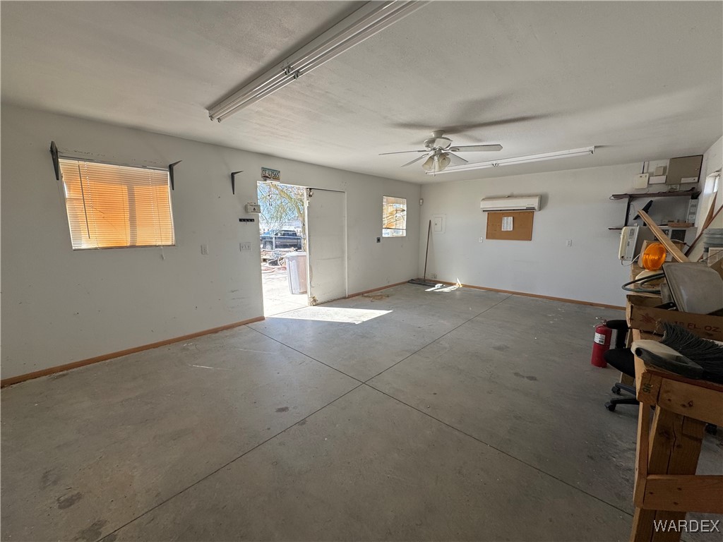 12248 South Yucca Frontage Road Yucca, AZ 86438 - Photo 14 of 16 a view of a livingroom with workspace and a window