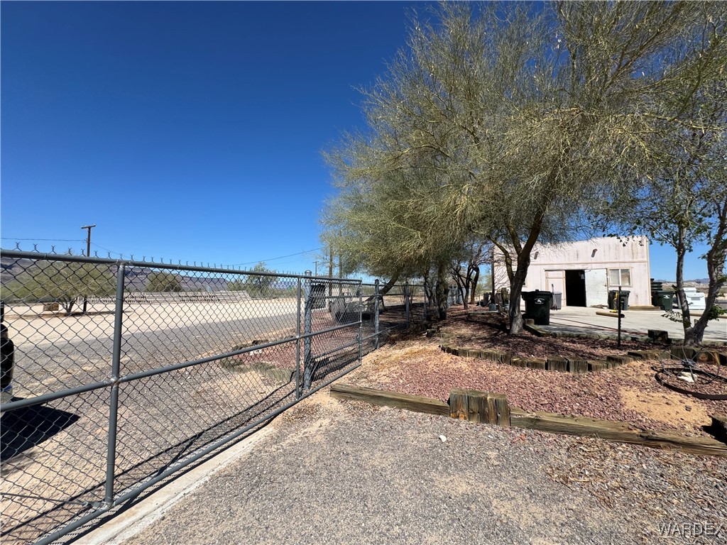 12248 South Yucca Frontage Road Yucca, AZ 86438 - Photo 6 of 16 a view of a backyard with sitting area