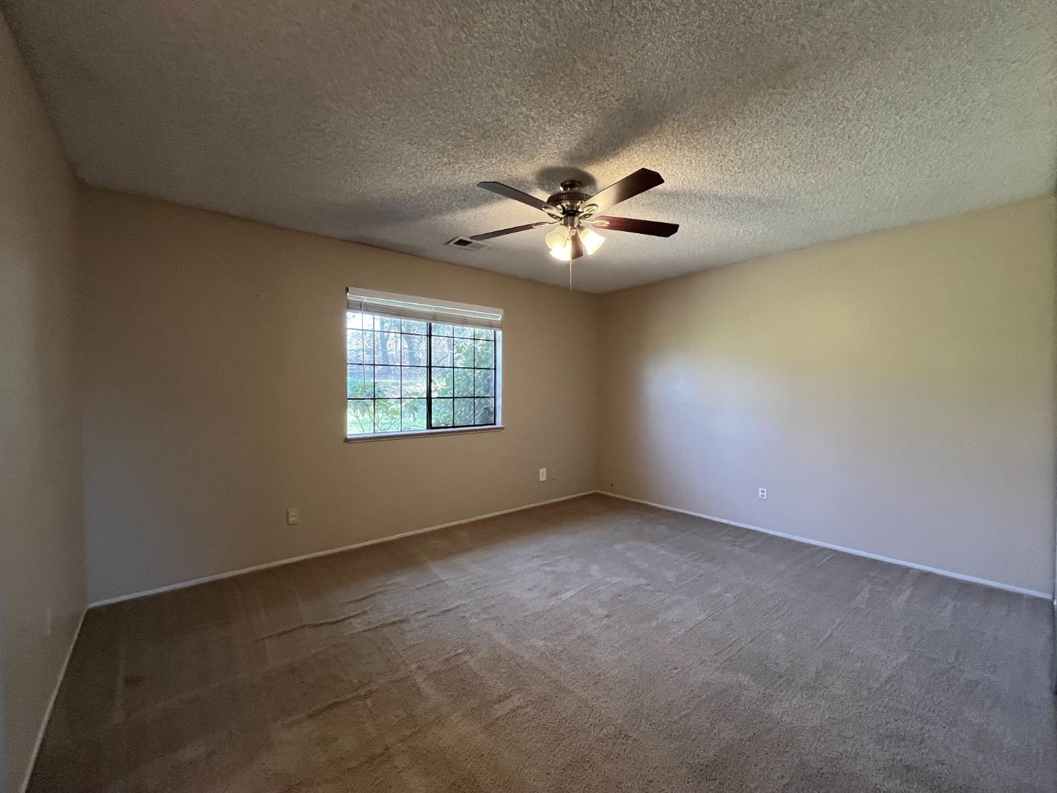10747 Mt Vernon Road Auburn, CA 95603 - Photo 17 of 33 an empty room with a window