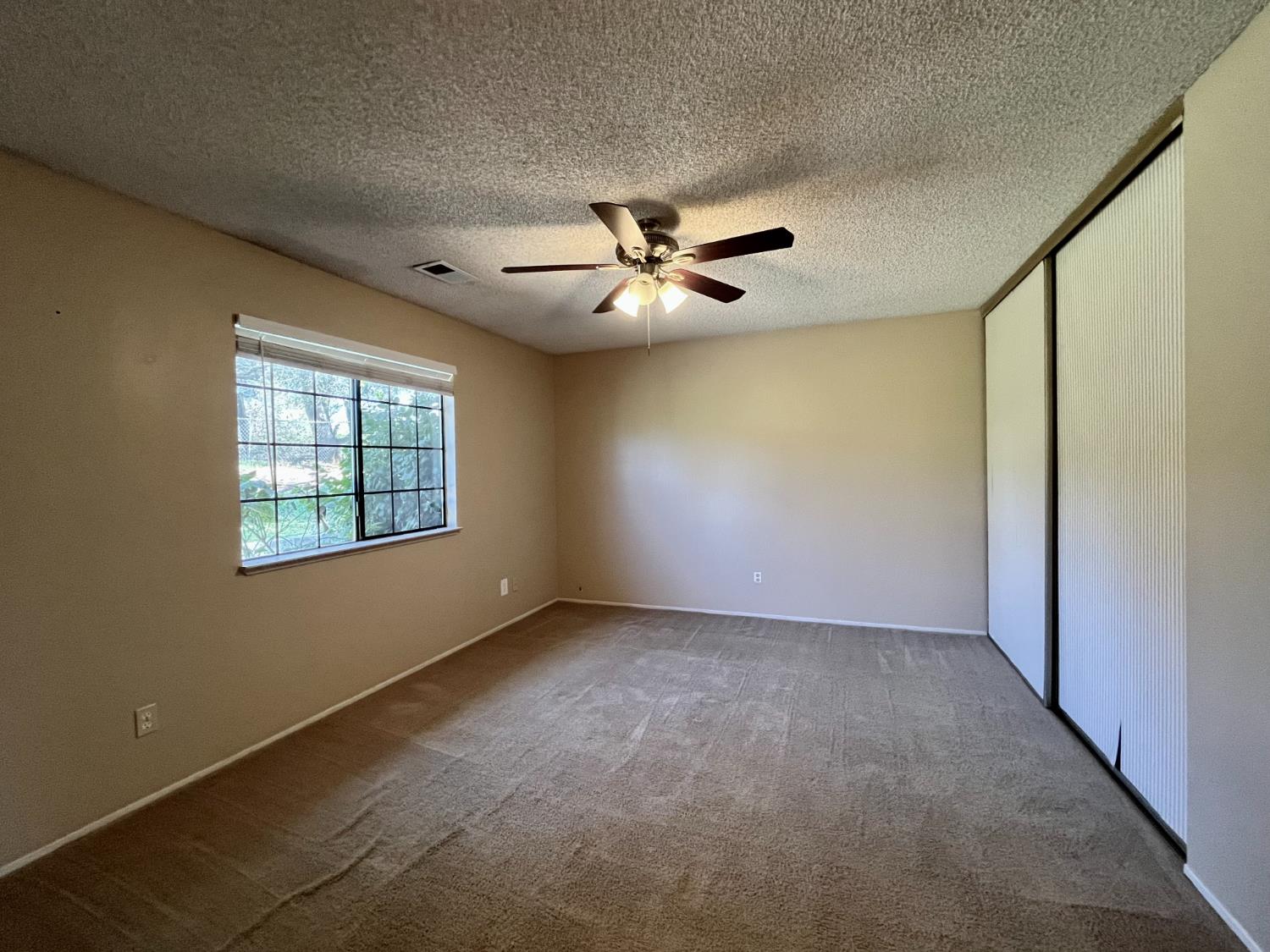 10747 Mt Vernon Road Auburn, CA 95603 - Photo 18 of 33 a view of an empty room with a window