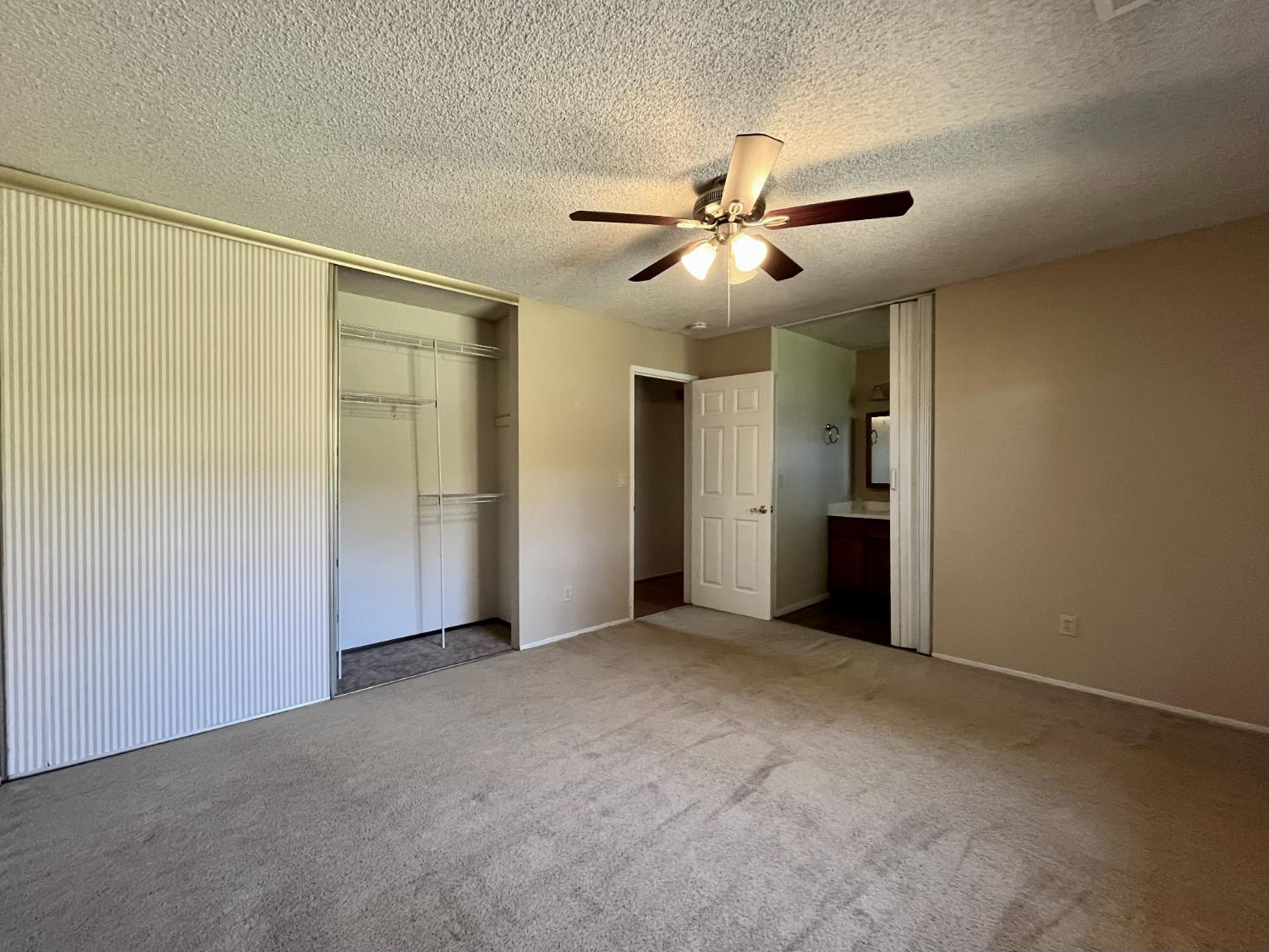 10747 Mt Vernon Road Auburn, CA 95603 - Photo 19 of 33 a view of an empty room and chandelier fan
