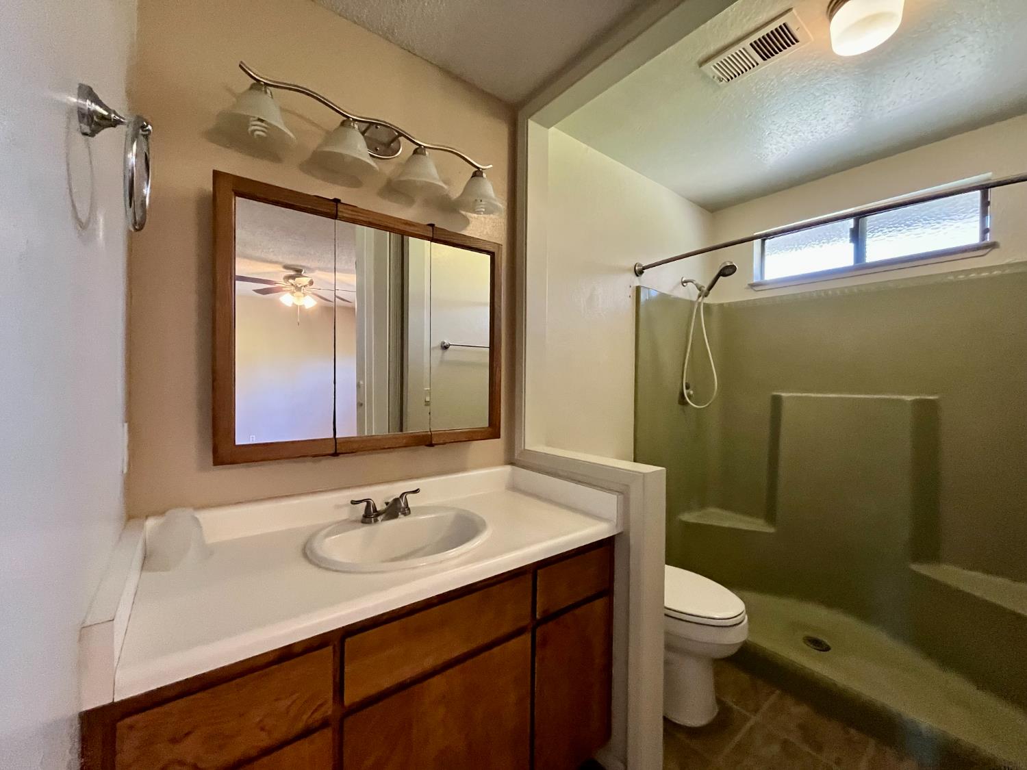 10747 Mt Vernon Road Auburn, CA 95603 - Photo 21 of 33 a bathroom with a sink toilet and shower