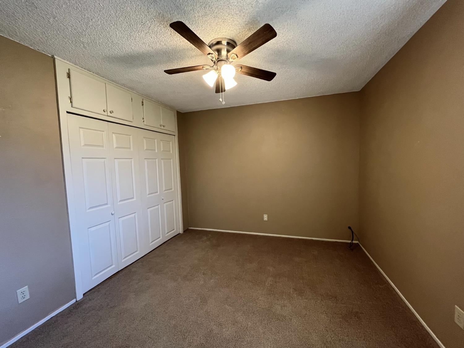 10747 Mt Vernon Road Auburn, CA 95603 - Photo 24 of 33 an empty room with closet and fan