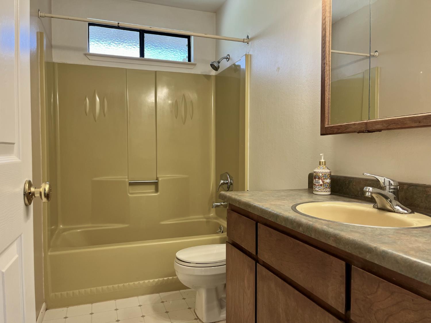 10747 Mt Vernon Road Auburn, CA 95603 - Photo 25 of 33 a bathroom with a granite countertop sink toilet and shower