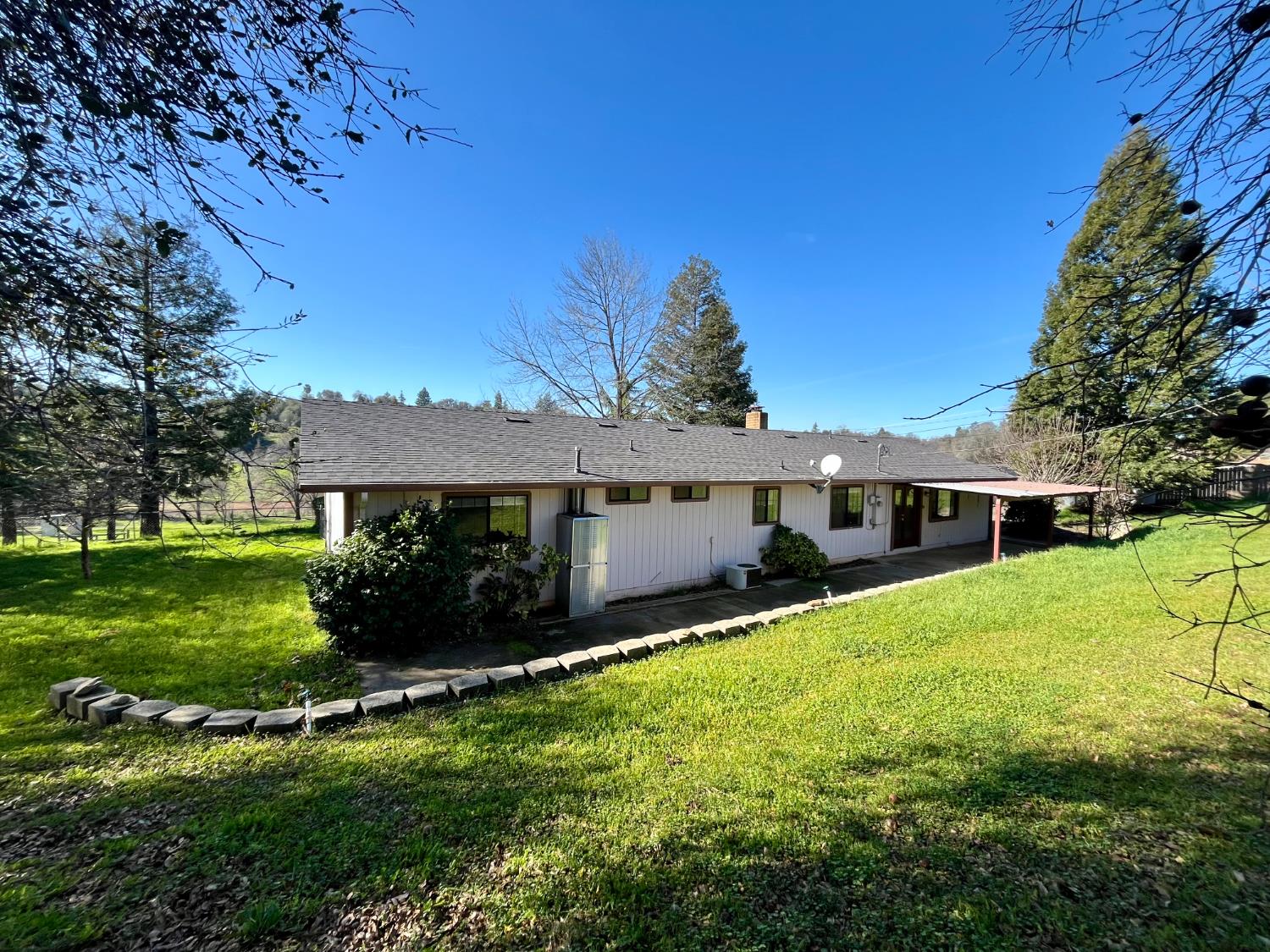 10747 Mt Vernon Road Auburn, CA 95603 - Photo 30 of 33 a view of a house with yard and a garden