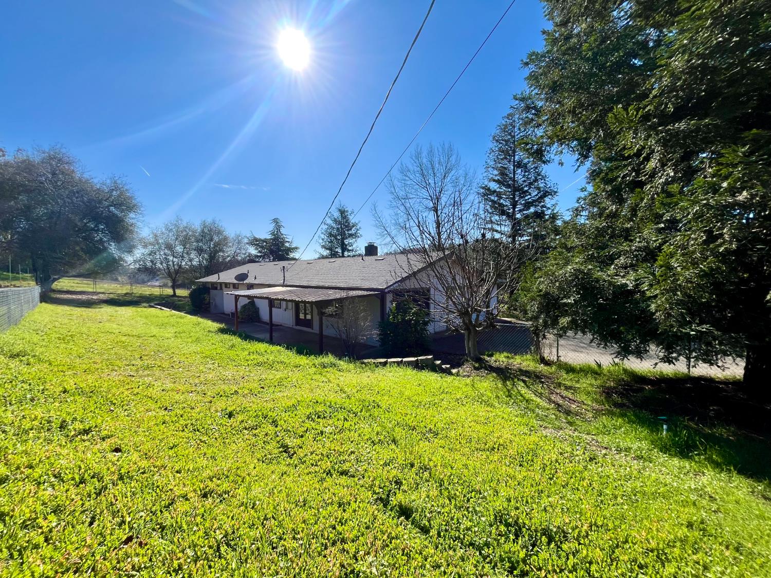 10747 Mt Vernon Road Auburn, CA 95603 - Photo 31 of 33 a view of a house with yard and sitting area