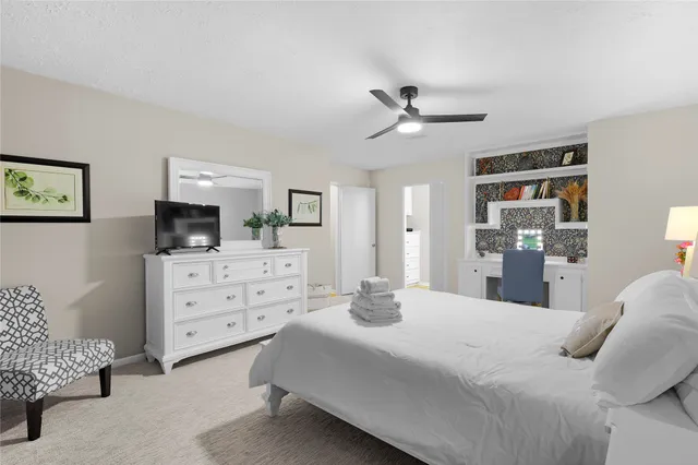 a bedroom with a bed and furniture