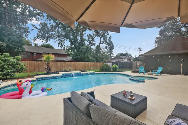 a view of backyard with seating space