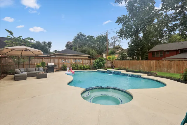 a view of swimming pool with a patio