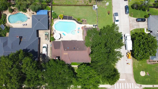 an aerial view of a house with a garden