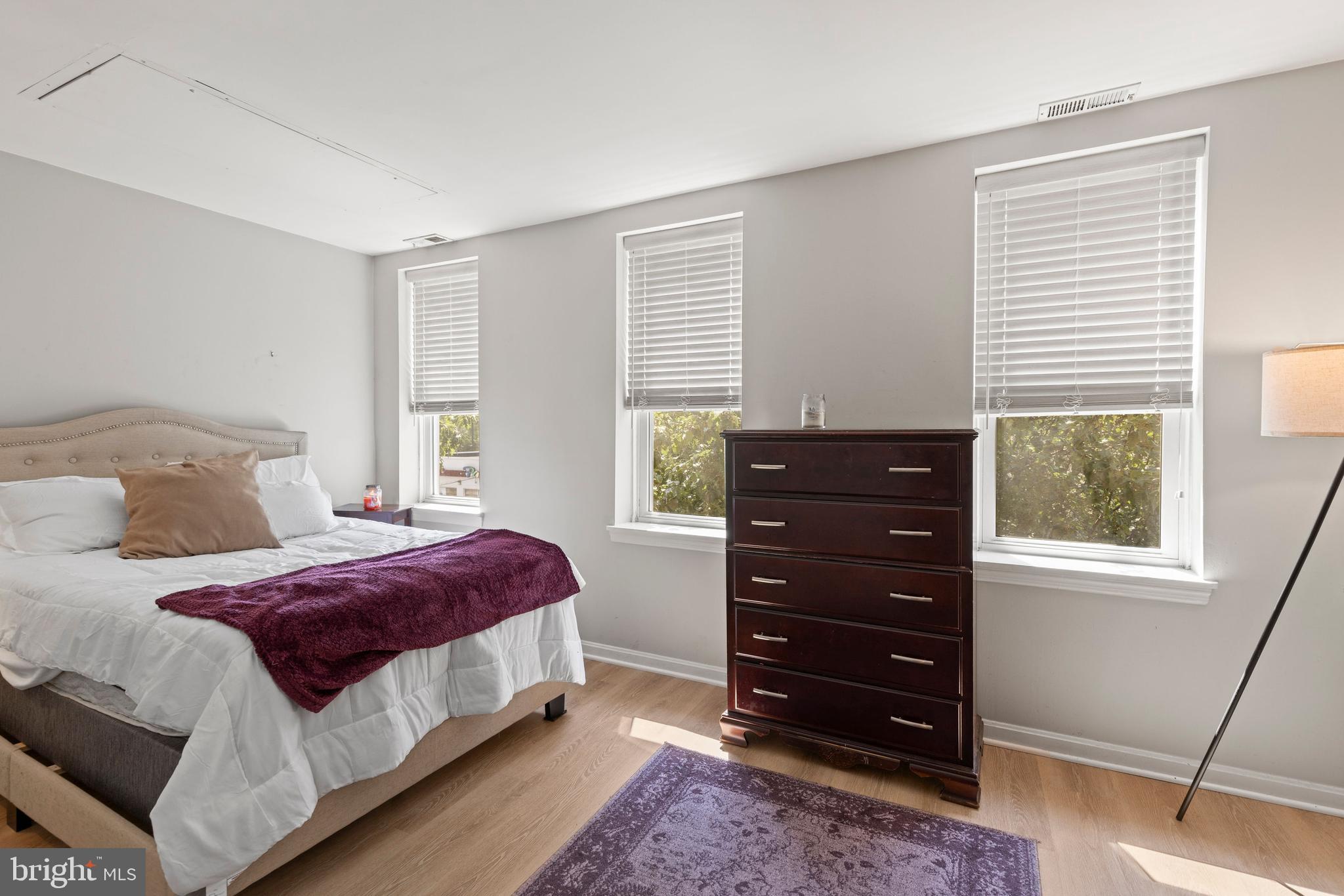 32 West Montgomery Street, Unit C Baltimore, MD 21230 - Photo 11 of 23 a bedroom with a bed and a dresser