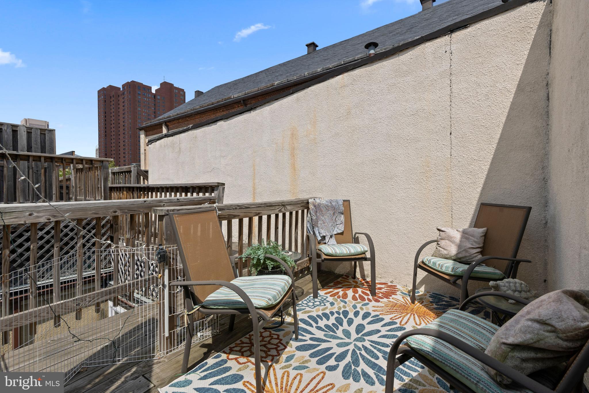 32 West Montgomery Street, Unit C Baltimore, MD 21230 - Photo 17 of 23 a balcony with table and chairs