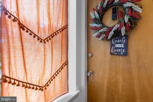 a front view of a building with outdoor seating
