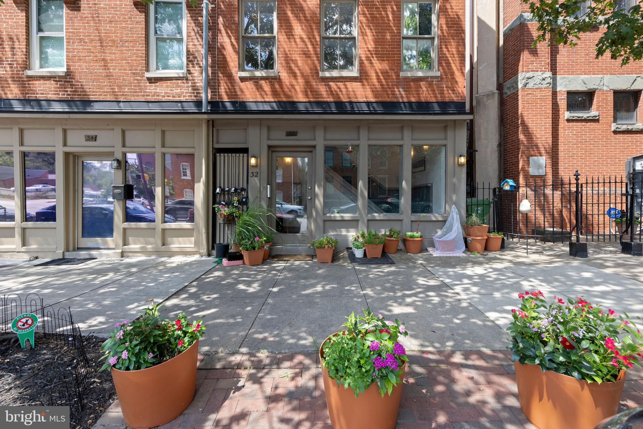 32 West Montgomery Street, Unit C Baltimore, MD 21230 - Photo 21 of 23 a front view of a building with outdoor seating