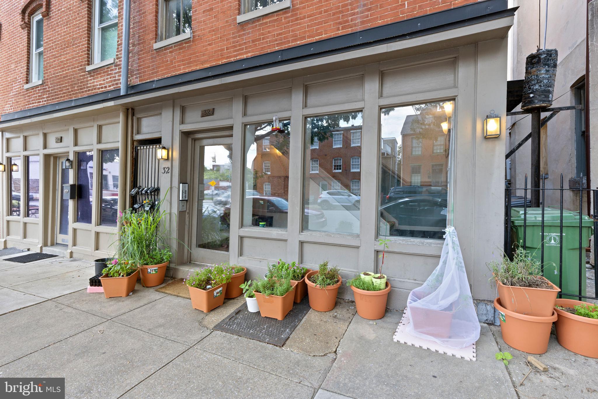 32 West Montgomery Street, Unit C Baltimore, MD 21230 - Photo 22 of 23 a view of a patio with dining table and chairs
