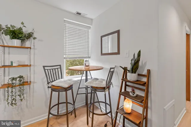a view of a livingroom with furniture and a window